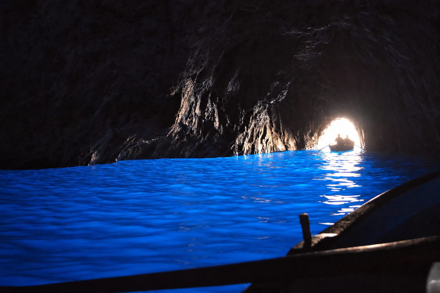 The Blue Grotto's water glowing electric from beneath, Capri