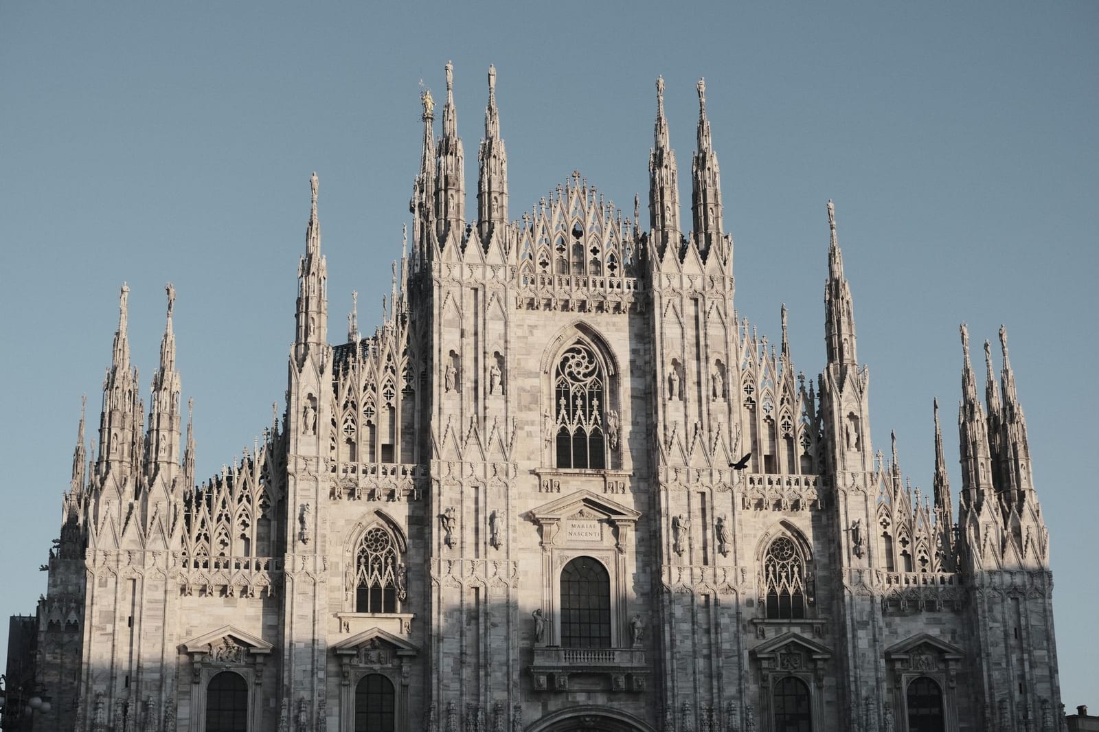 The marble facade of Milan Cathedral, a forest of spires in white Candoglia stone
