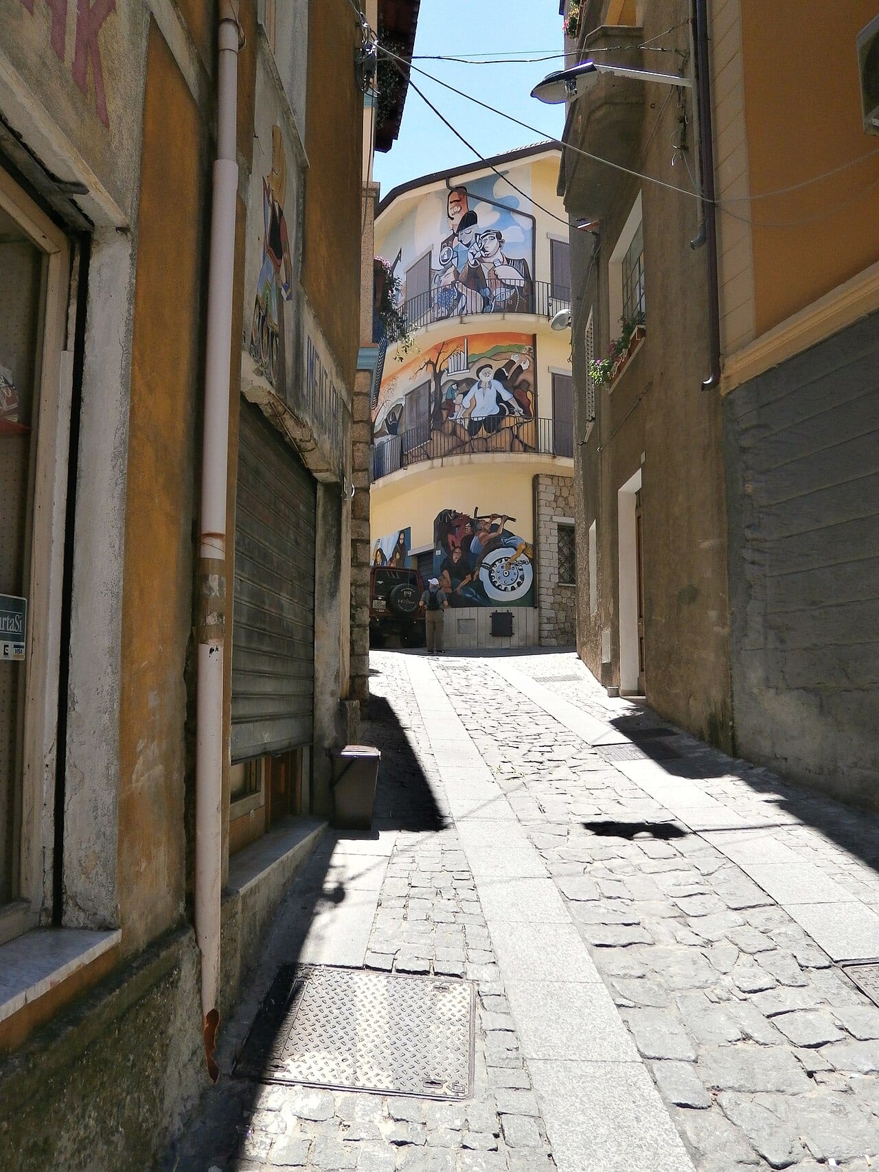Political murals lining a lane in Orgosolo, the Barbagia's painted town
