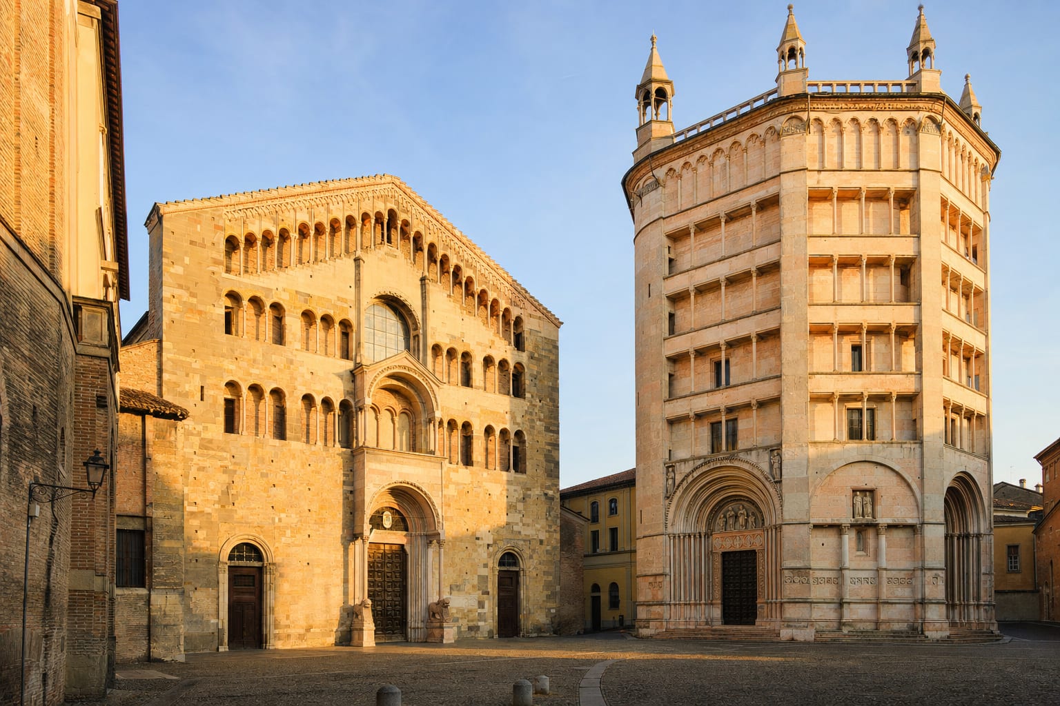 Parma's cathedral and pink baptistery sharing their Romanesque piazza