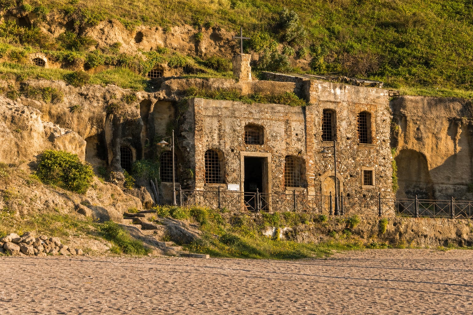 The rock-carved church of Piedigrotta at the edge of Pizzo's beach