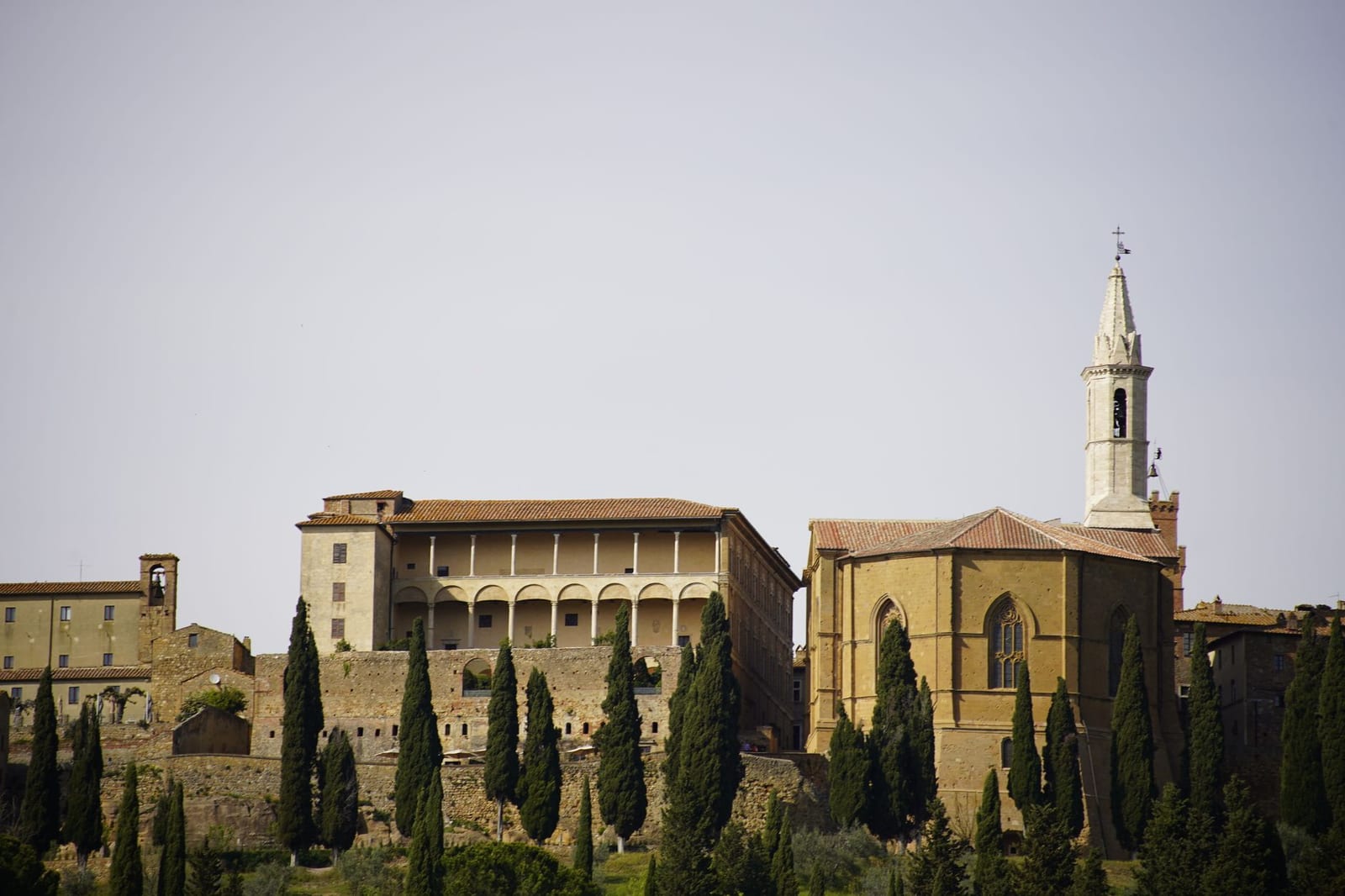 Pienza Cathedral and Palazzo Piccolomini above the Val d'Orcia cypresses