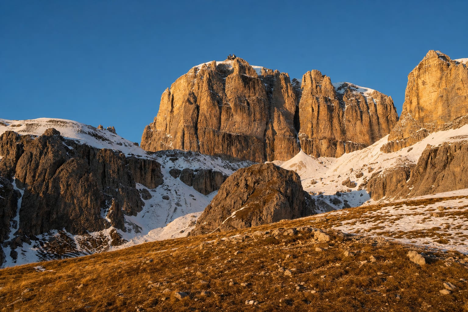 The sheer walls of Sass Pordoi above the pass, western Dolomites