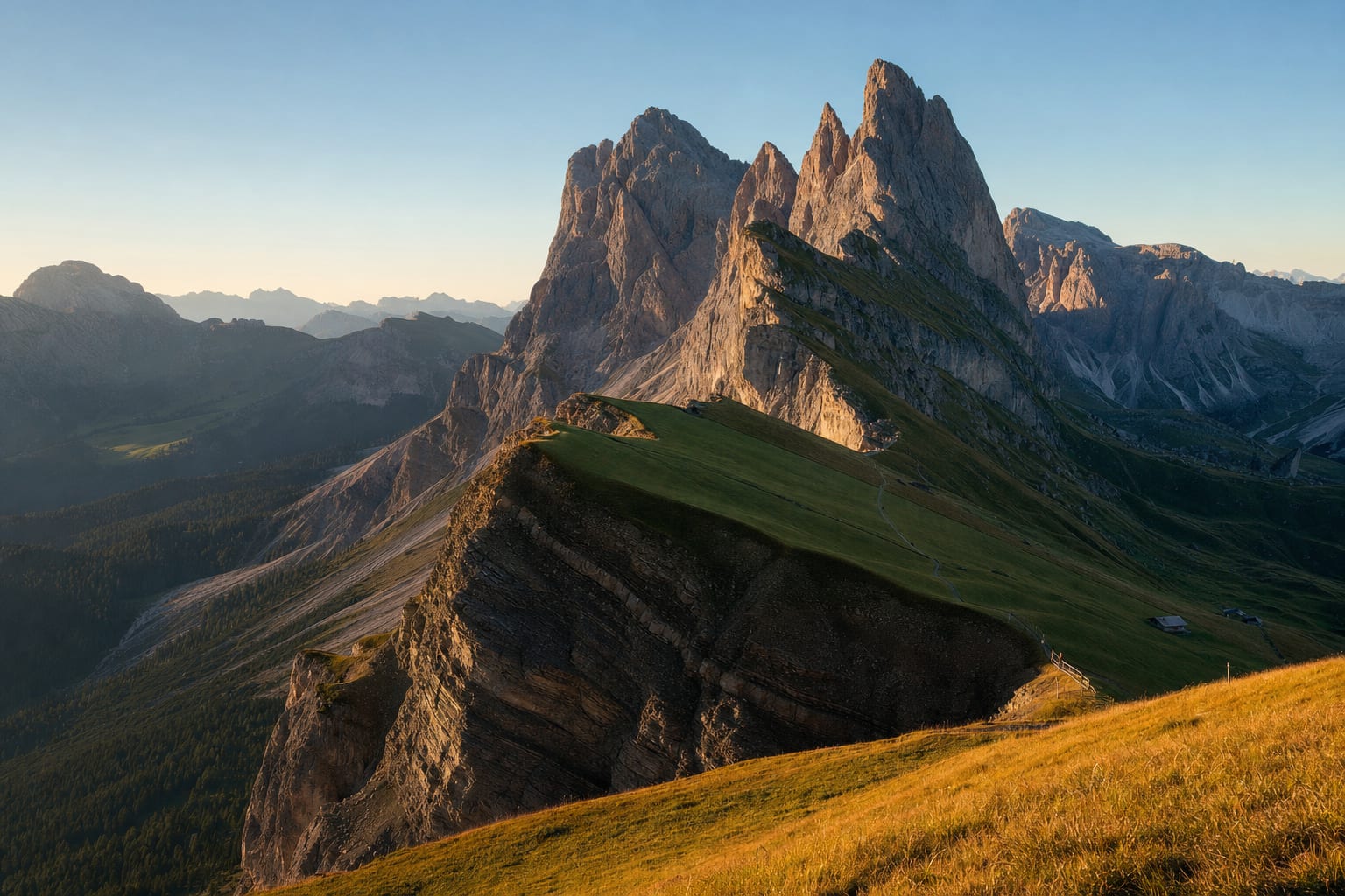 Seceda's torn ridge dropping to the Odle spires at golden hour