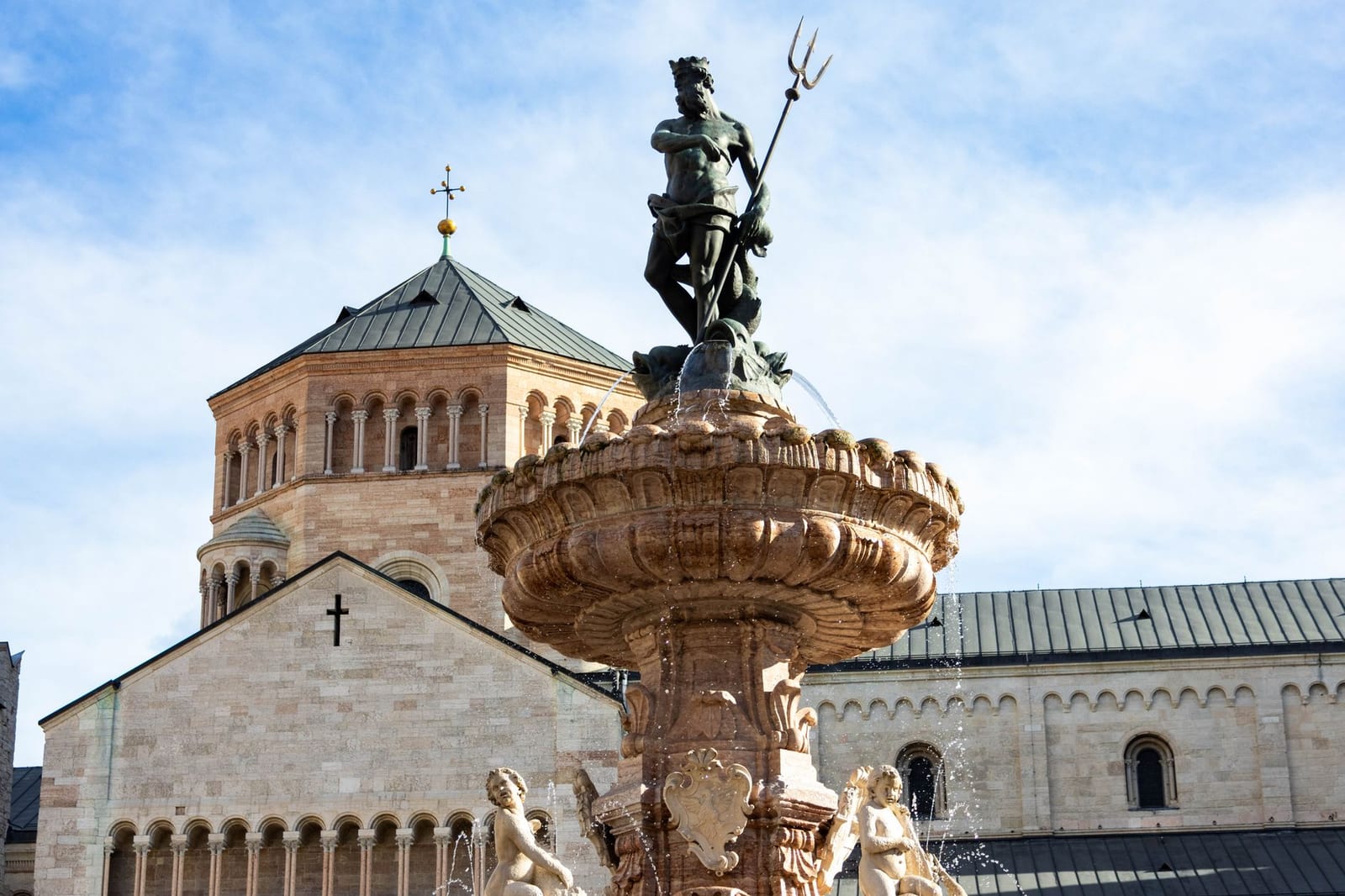 Trento Cathedral behind the Neptune fountain on Piazza Duomo