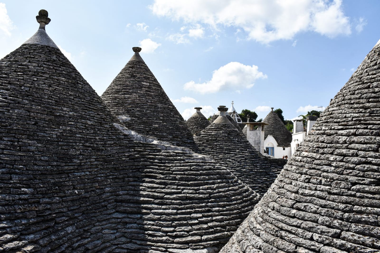 The stone cones of Alberobello's trulli crowding Rione Monti