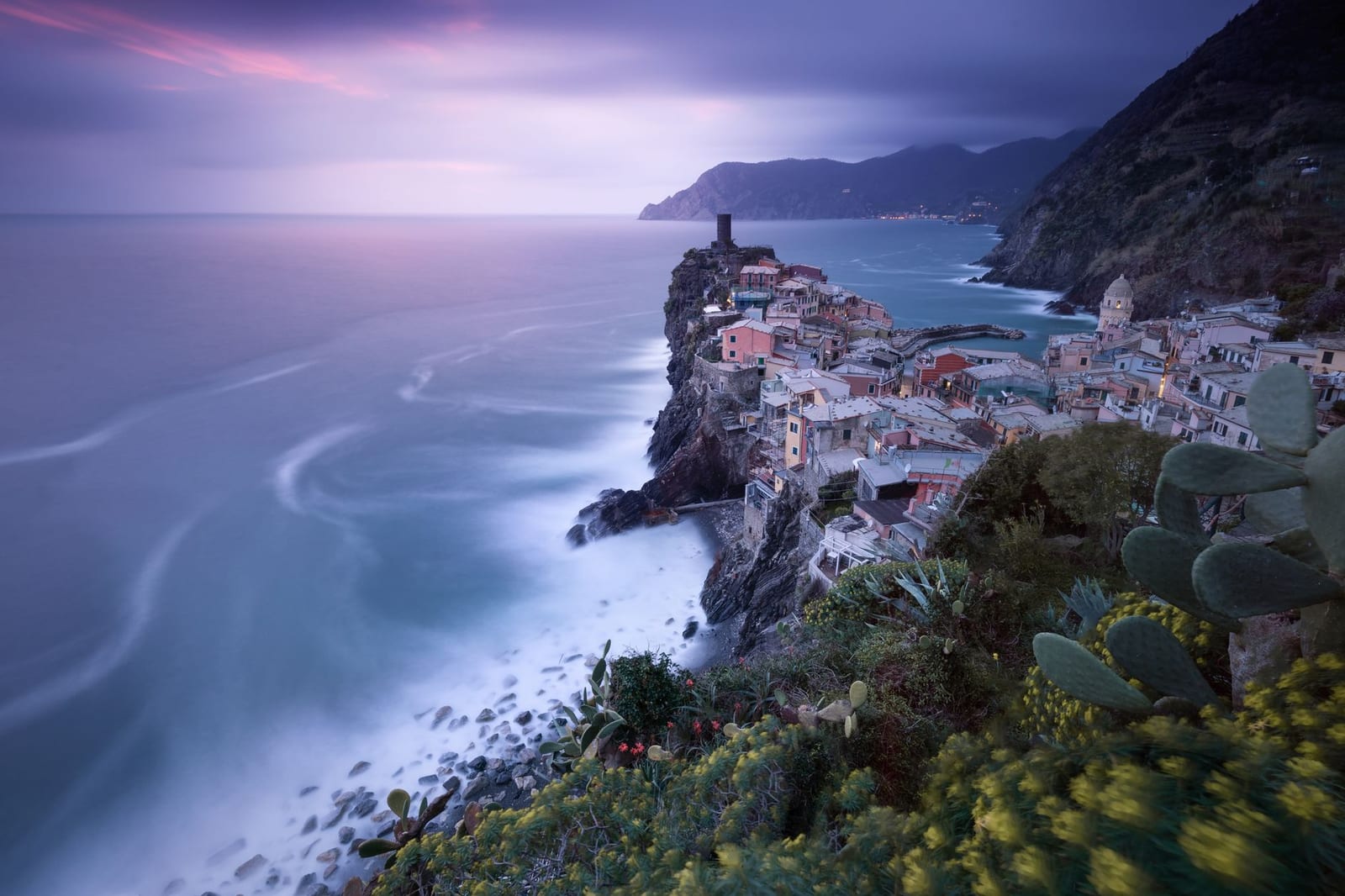 Vernazza's harbor and Doria tower glowing at dusk, Cinque Terre