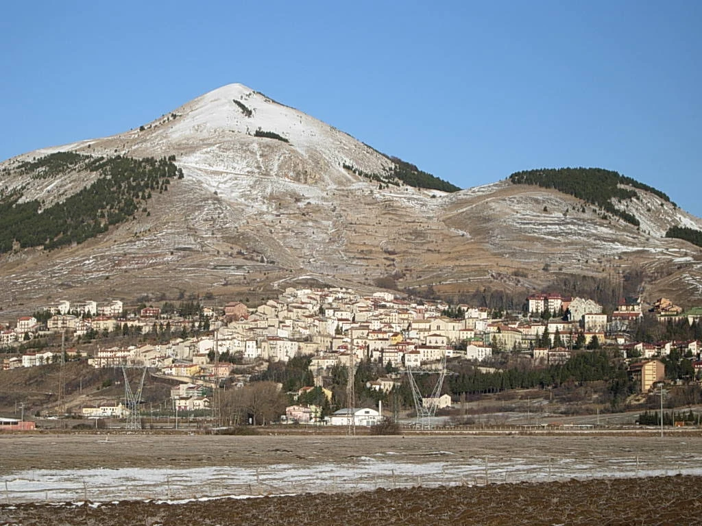 Rivisondoli below the mountain with patchy winter snow