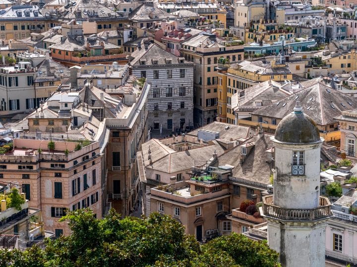 The striped domes and rooftops of old Genoa