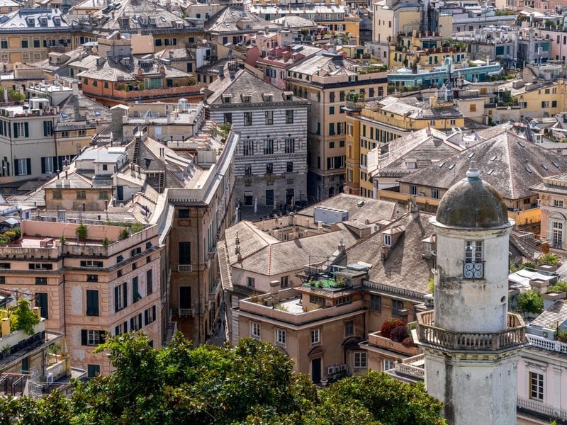 The striped domes and rooftops of old Genoa