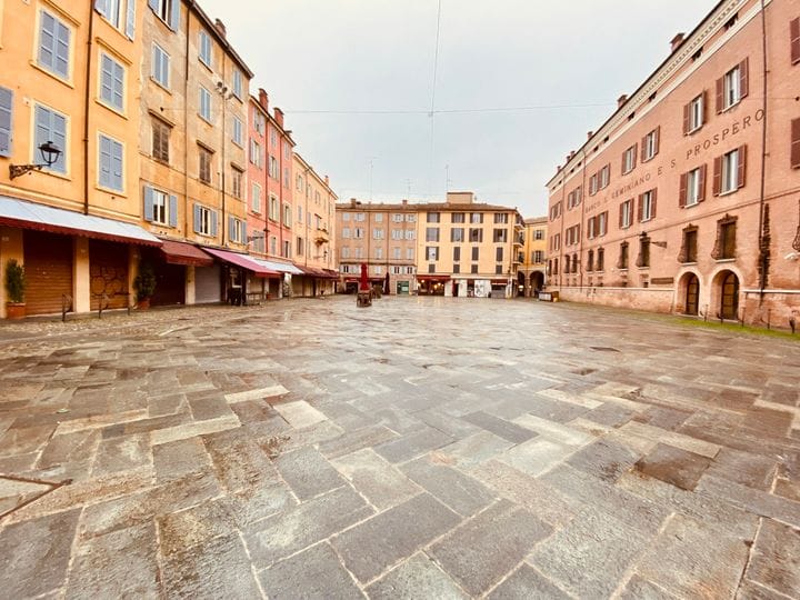 Rain-polished stones on a Modena piazza