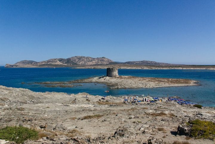 The tower of La Pelosa across Stintino's shallows
