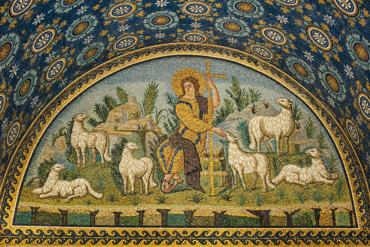 A haloed seated figure among six sheep, with an upright gold cross-staff and a blue-and-gold patterned barrel vault.