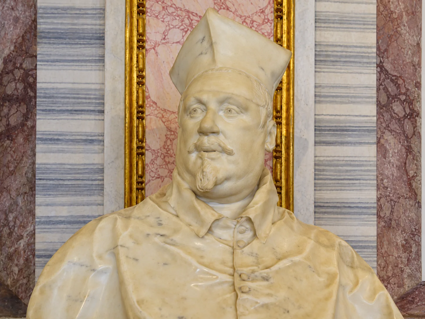 Cardinal Scipione Borghese’s marble face, biretta and upper robes in Bernini’s portrait bust