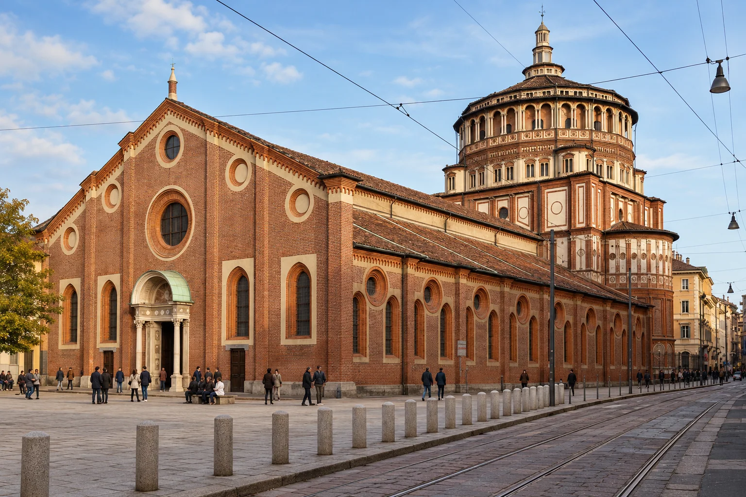 Terracotta gabled front and side of Santa Maria delle Grazie with the tribune rising behind
