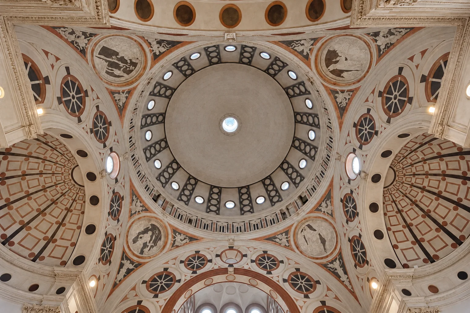 Decorated dome, circular openings and supporting arches inside the tribune of Santa Maria delle Grazie