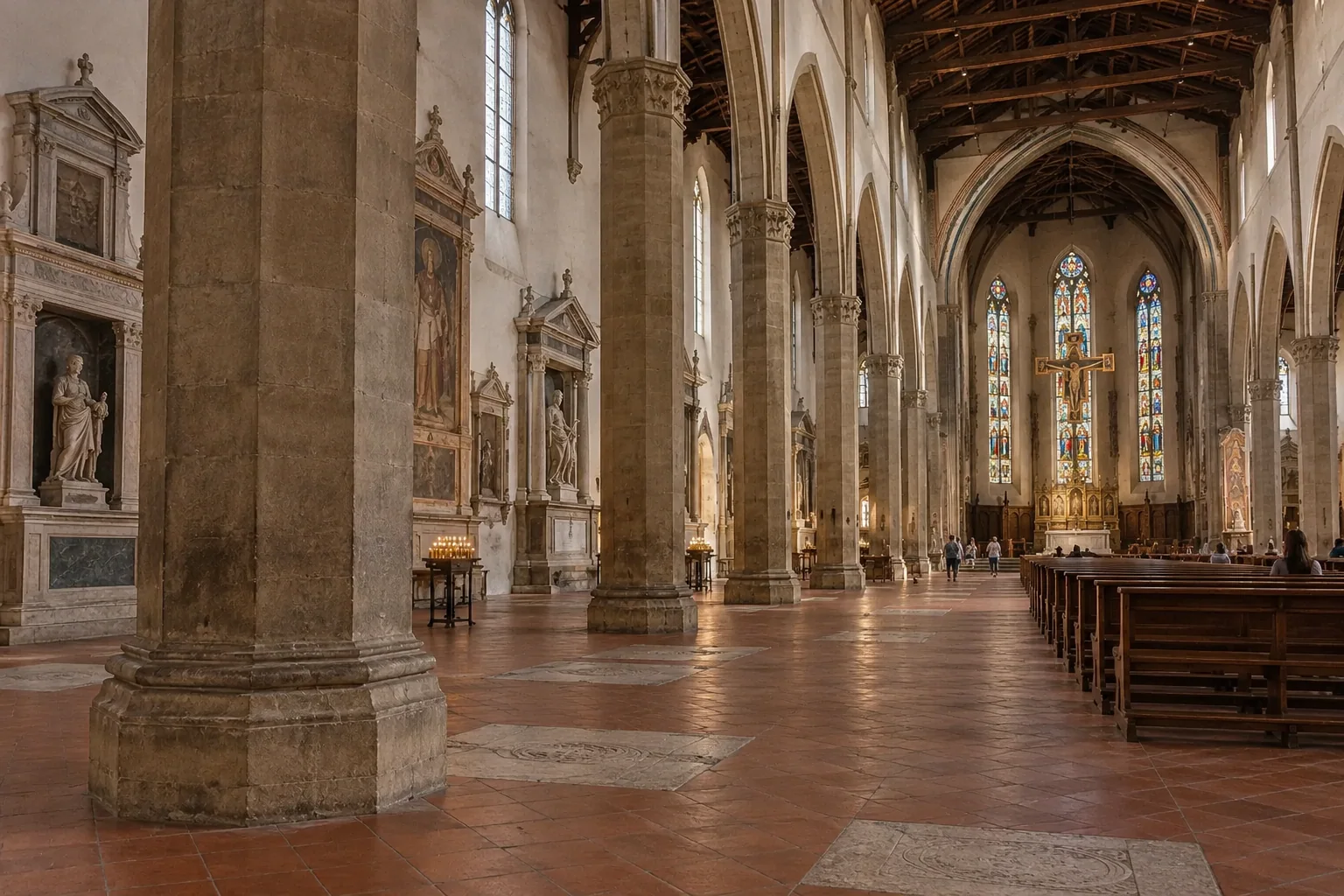 Octagonal stone pillars, timber roof and terracotta floor in the nave of Santa Croce in Florence