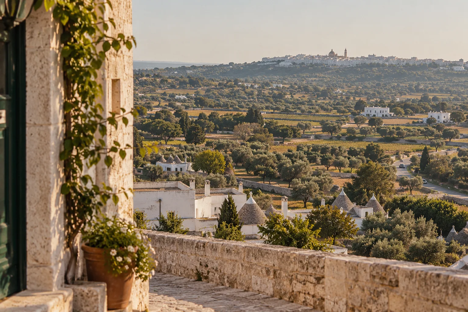 The Itria Valley seen from the edge of Locorotondo, with fields, olive trees and trulli