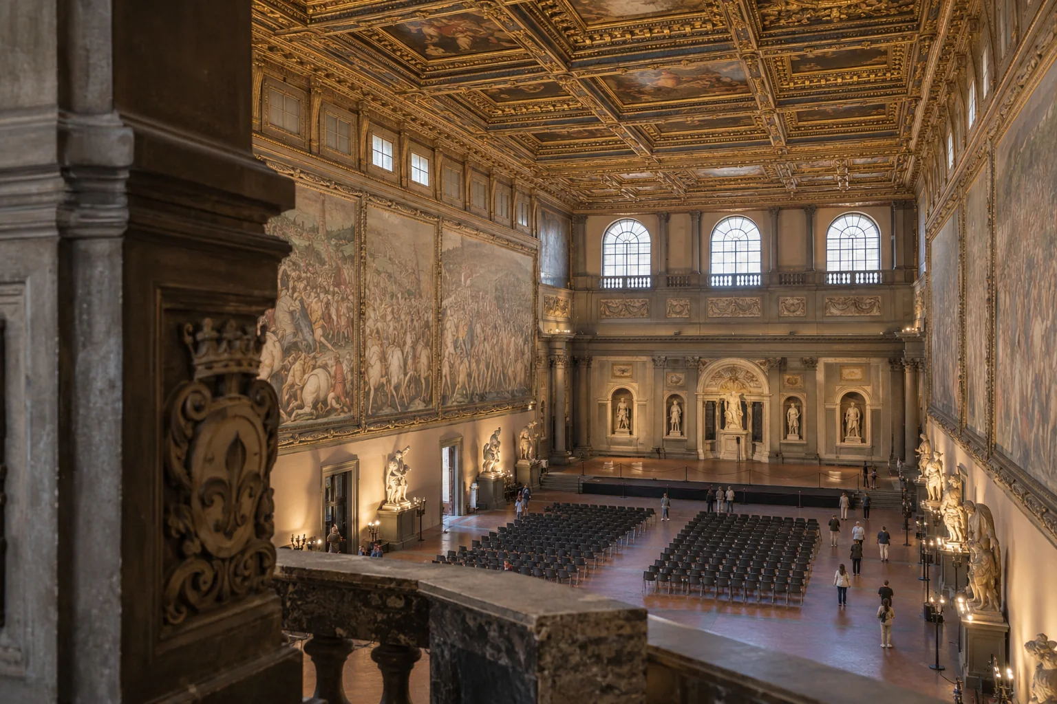 The Salone dei Cinquecento seen from the balcony, with its gilded ceiling and battle frescoes on the long walls