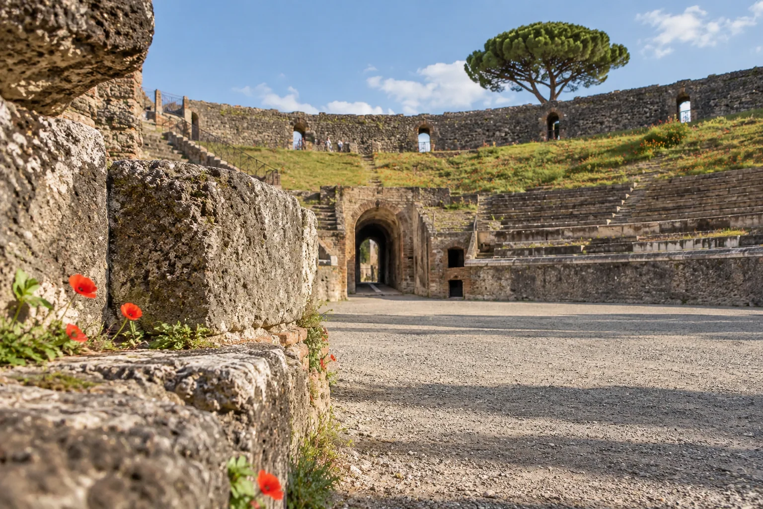 The grassy bank and stone seating of the Pompeii amphitheatre