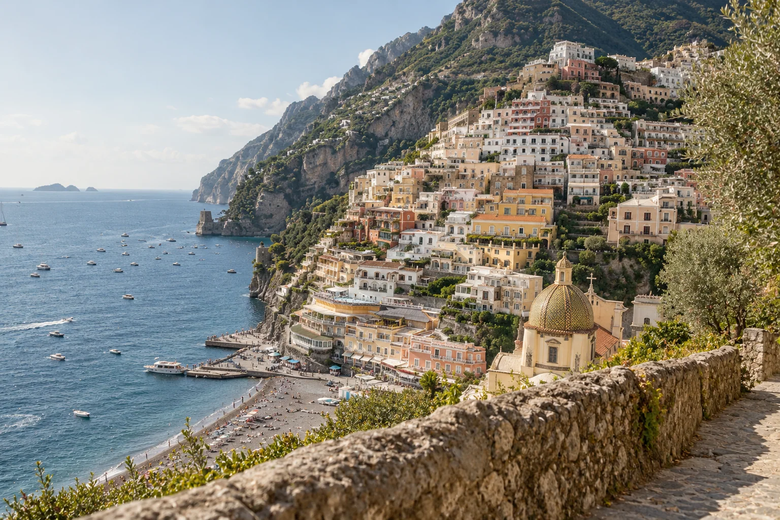 Positano's pastel houses descending toward the Amalfi Coast sea
