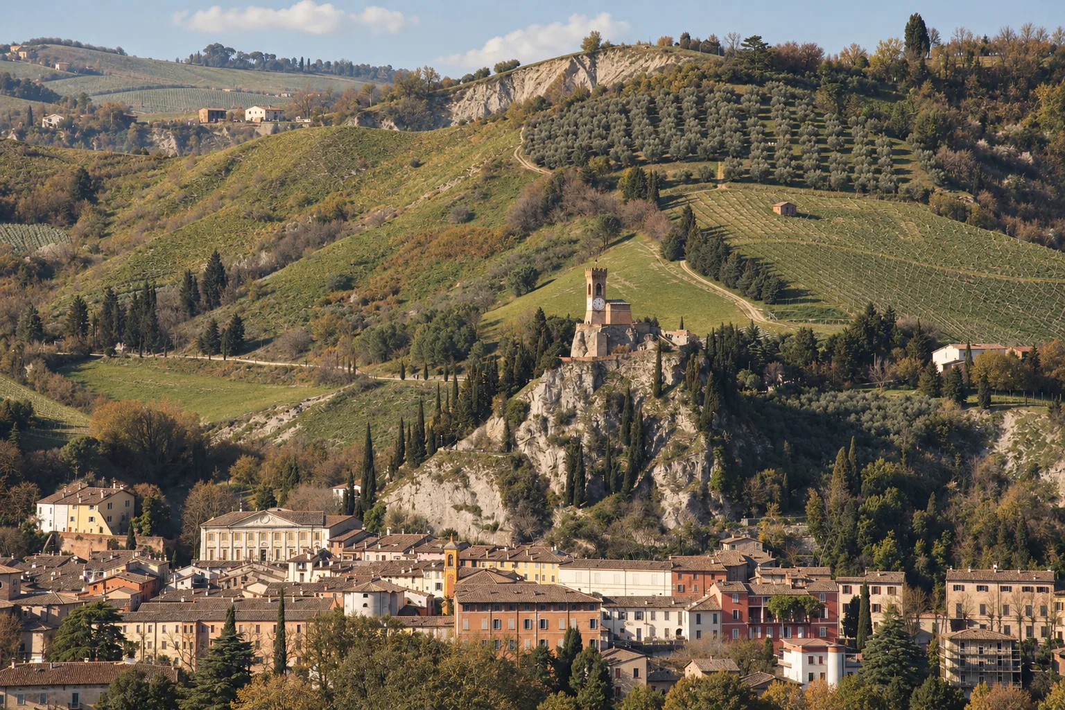 The clock tower of Brisighella above terracotta rooftops