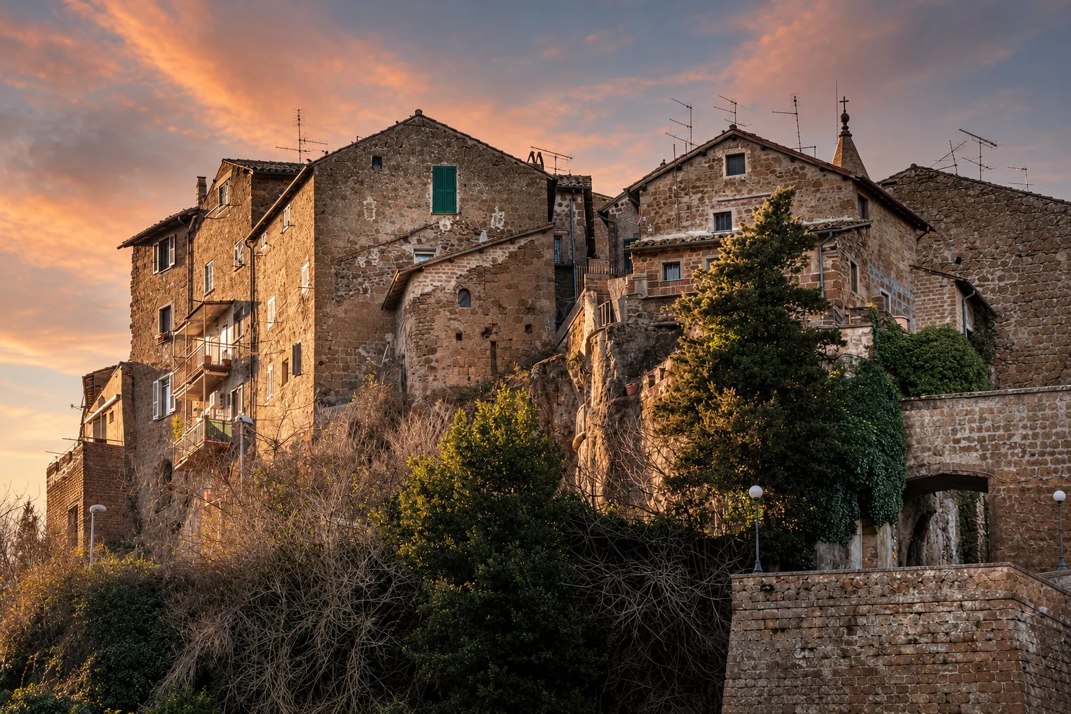 Calcata clinging to its tufa outcrop at dusk