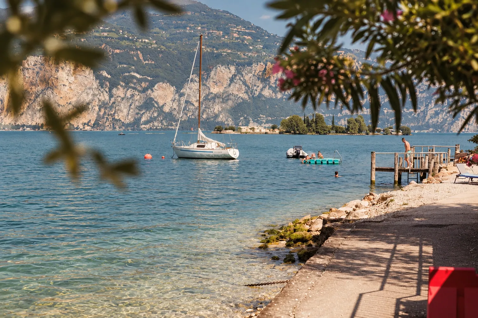 A sailboat at rest off the shore of Garda