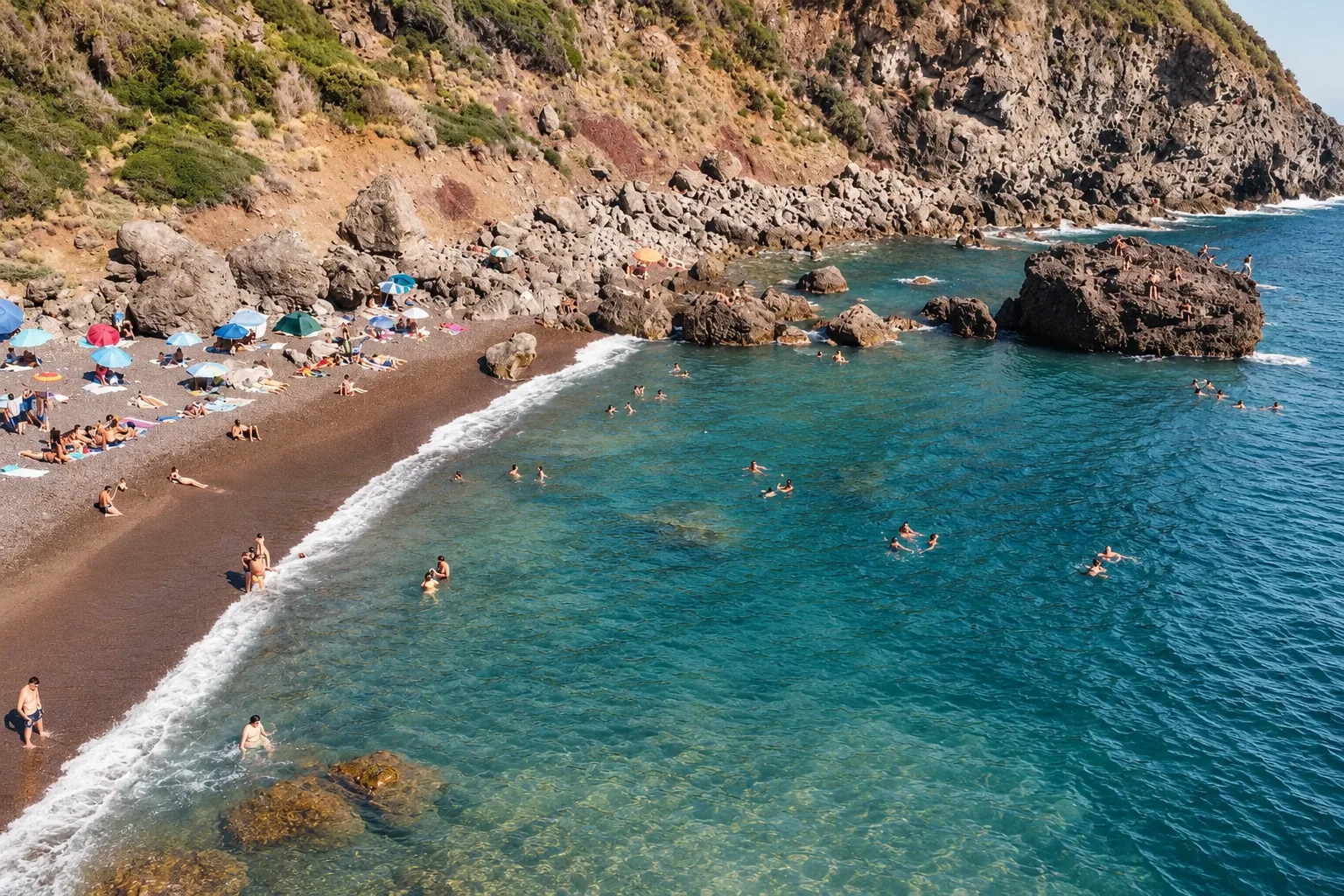Swimmers in a rocky cove on the Livorno coast