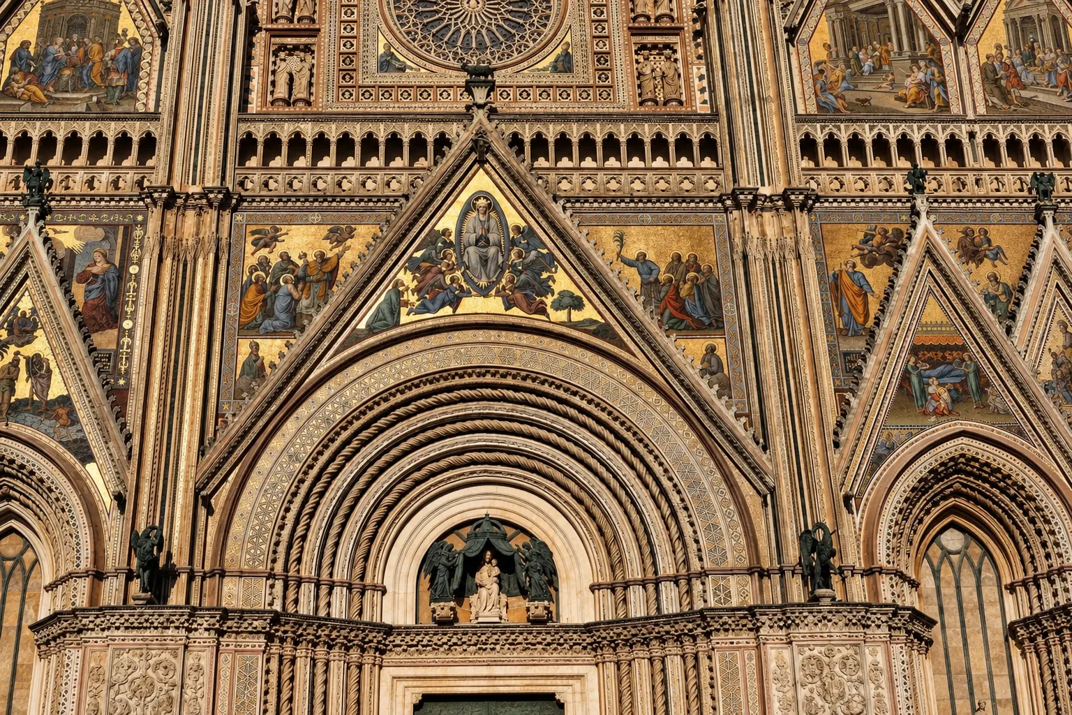 Gold mosaics on the facade of Orvieto's Duomo