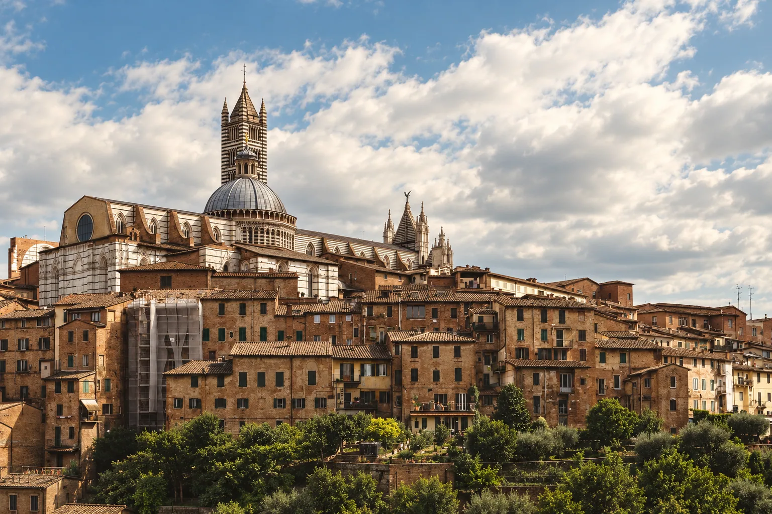 Siena's striped Duomo rising above the city