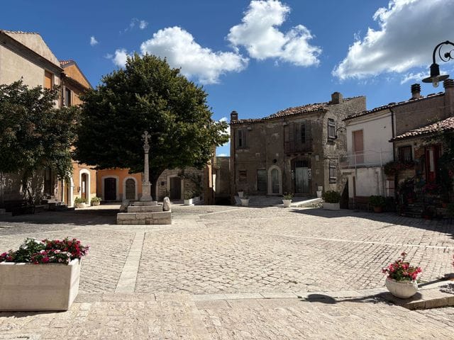 A quiet stone piazza in a Molise borgo