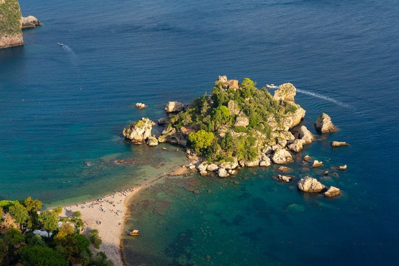 Isola Bella curling into the Ionian at Taormina, Sicily