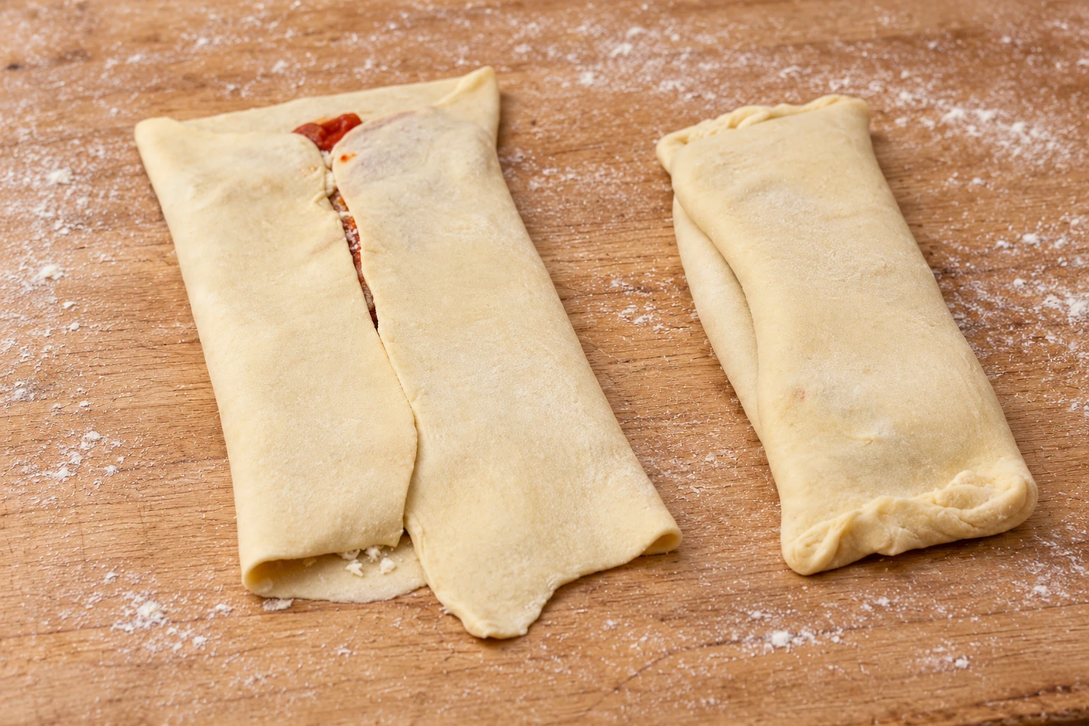 Raw dough with folded side flaps beside a rectangular pastry packet.